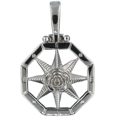 Compass rose pendants in sterling silver.  Original designs from TS. Brown Jewelry.
