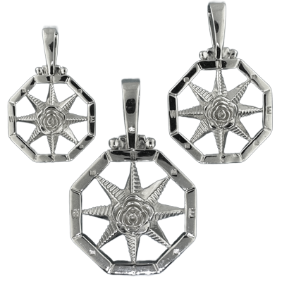 Compass rose pendants in sterling silver.  Original designs from TS. Brown Jewelry.